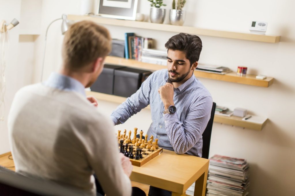 man-playing-chess-1-e1650352463437.jpg